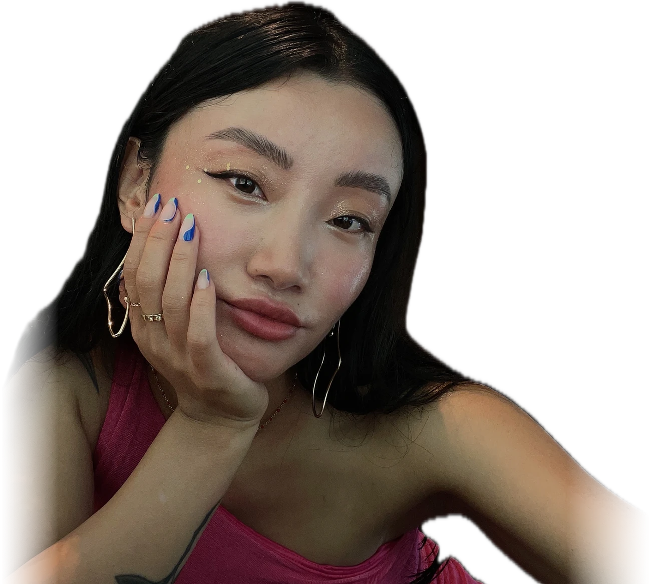 Wendy Wang in a pink dress, chin in her hand